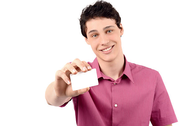 istock Man offering you a business card.Blured model, focused card. 180071812