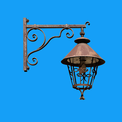 A retro street lantern isolated on the blue background