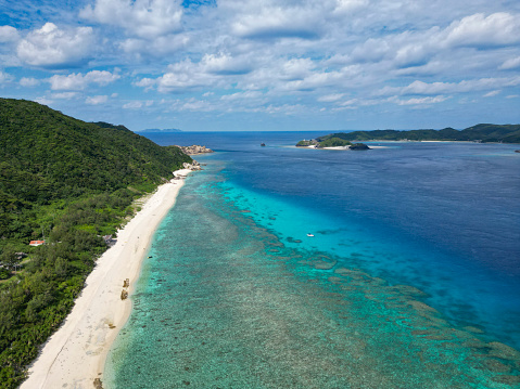 nishibama beach, kerama blue water and coral reefs at the kerama islands in okinawa, japan. drone point of view.