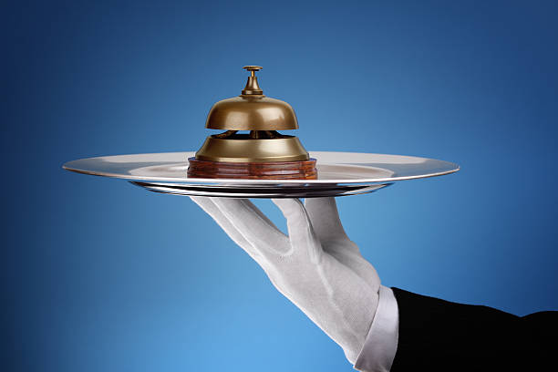 Assistance Hotel reception service bell on a silver tray concept for assistance and support hotel occupation concierge bell service stock pictures, royalty-free photos & images