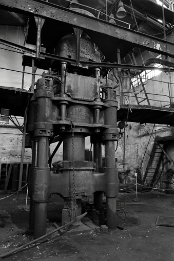 Old forging press in an abandoned shipbuilding factory.