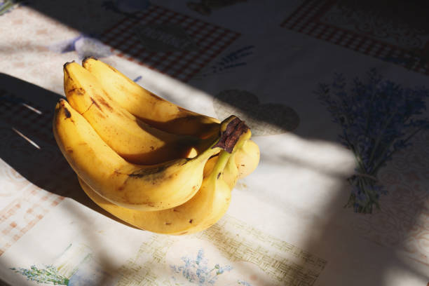 istock Bunch of bananas on the table 1800793710