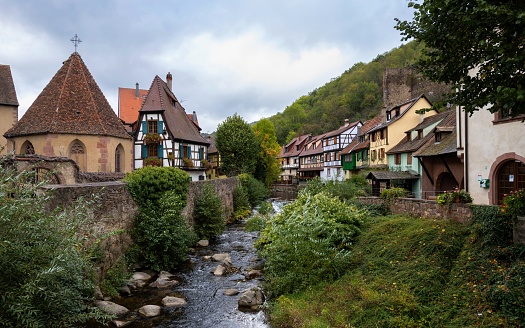 Kaysersberg, France, October 16, 2020: View of a street in the center of this Alsatian small town under sloudy autumn sky. Kaysersbert is situated on the Alsatian Wine Route.