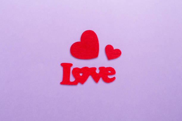 istock Felt word love with hearts on color background, top view 1800809439