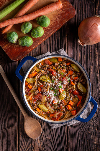 Cooking Italian Beef and Vegetable Stew in a Dutch Oven
