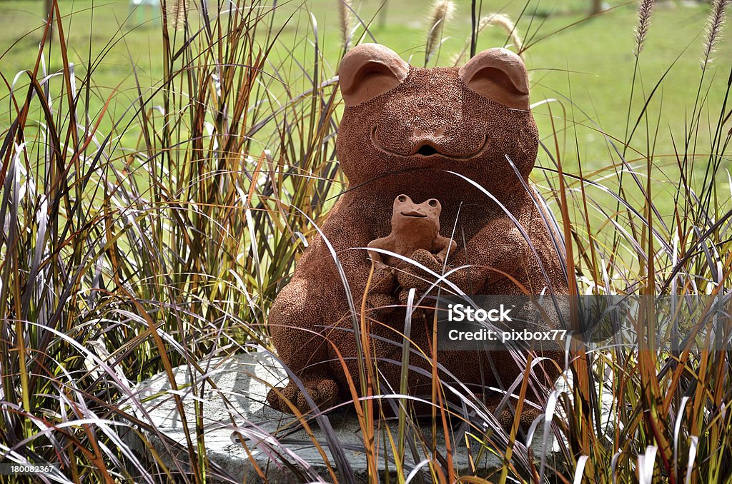 Frog earthenware sculpture Frog earthenware sculpture in the garden, Thailand Animal Stock Photo