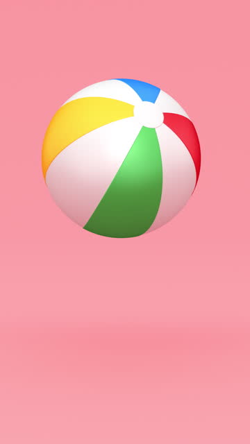 Perfectly seamless loop. Colorful inflatable beach ball bouncing  on the light Pink background. Summer vacations theme.