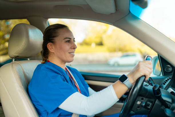 istock Female doctor driving to work 1800997495