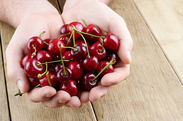 istock Handful of cherries 180102487
