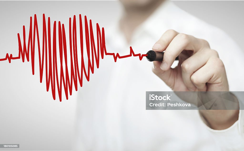 drawing chart heartbeat High resolution man drawing chart heartbeat Drawing - Activity Stock Photo