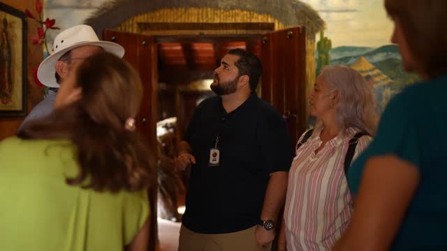 Tourist guide giving a tour to seniors tourist at museum