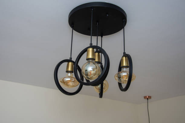 istock Modern chandelier Glowing light bulb filament 1801064273
