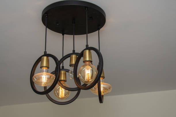 istock Modern chandelier Glowing light bulb filament 1801064401