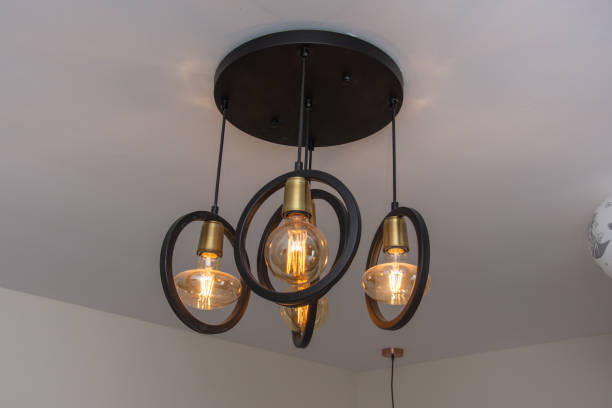 istock Modern chandelier Glowing light bulb filament 1801064788