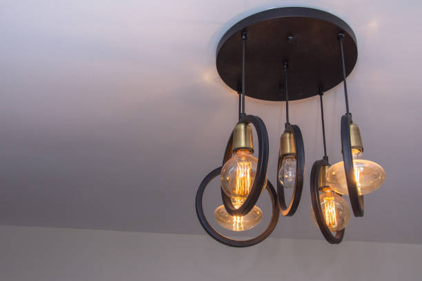 istock Modern chandelier Glowing light bulb filament 1801064790