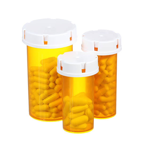 istock Pill bottles isolated. American three medical containers 180107372