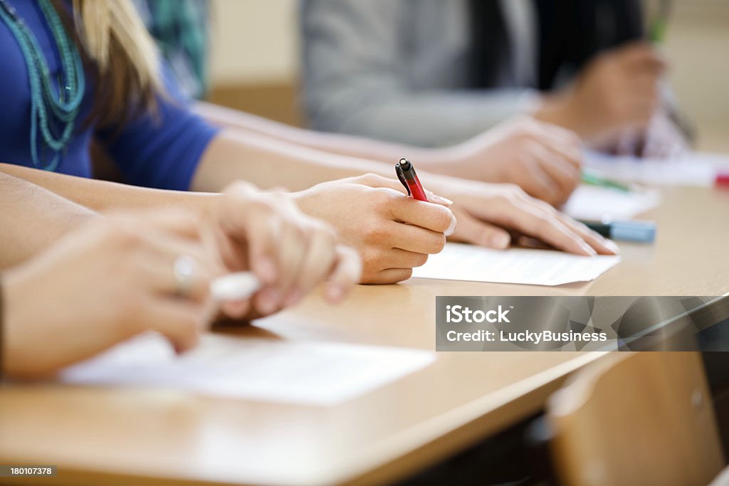 hnads of students Close-up of writing hands of students at course Educational Exam Stock Photo