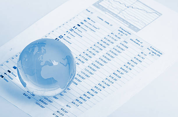 istock Glass globe and pen on finance 180107637