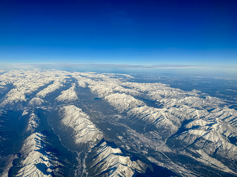 Canmore, Alberta - November 16, 2023: Aerial views of the Rocky Mountains surrounding Canmore Alberta