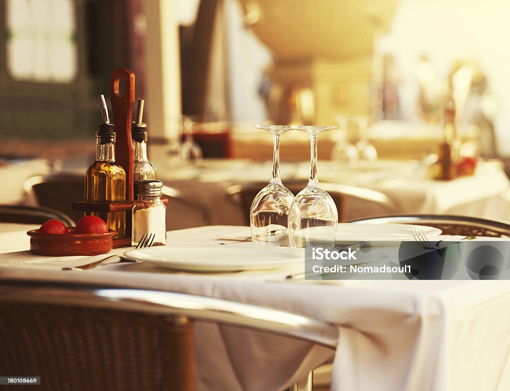 Restaurant table at sunset Empty outdoor restaurant table at sunset Restaurant Stock Photo