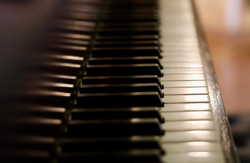 Closeup of antique piano keys in natural light
