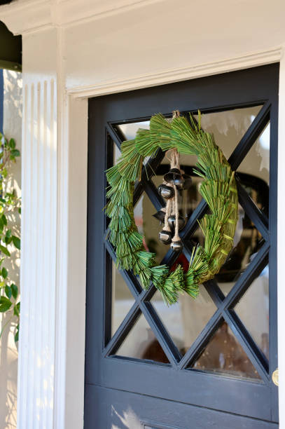 istock Pine garland wreath with decorative brass bells 1801124460