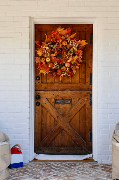 istock Vintage brick cottage with heavy wood front door 1801128076