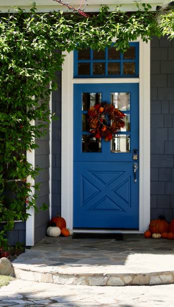 istock Bright blue front door to a charming beach bungalow 1801128081