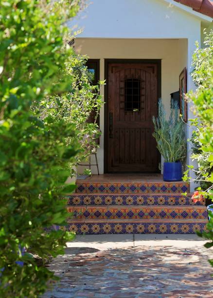 istock Rustic heavy wood door with ceramic tiles on the front steps 1801128086