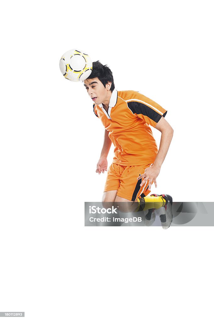 Joueur de football en direction de la balle - Photo de Joueur de football libre de droits