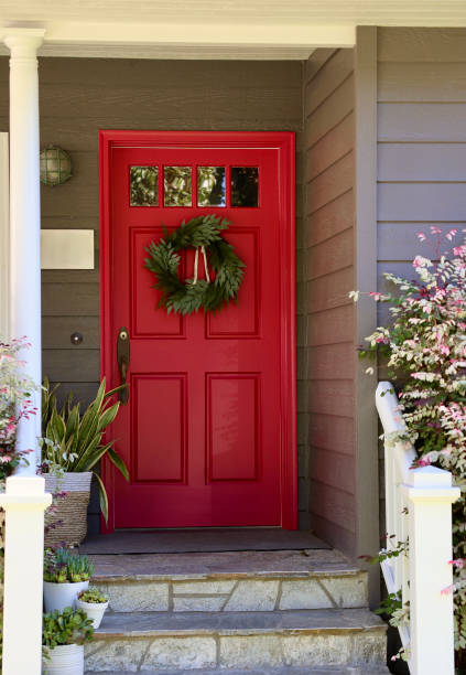 istock Bright red front door on a charming bungalow 1801131730