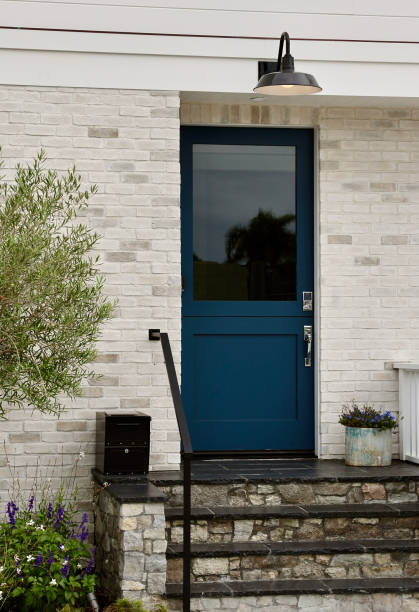 istock Teal Dutch door to a modern style beach house 1801131746