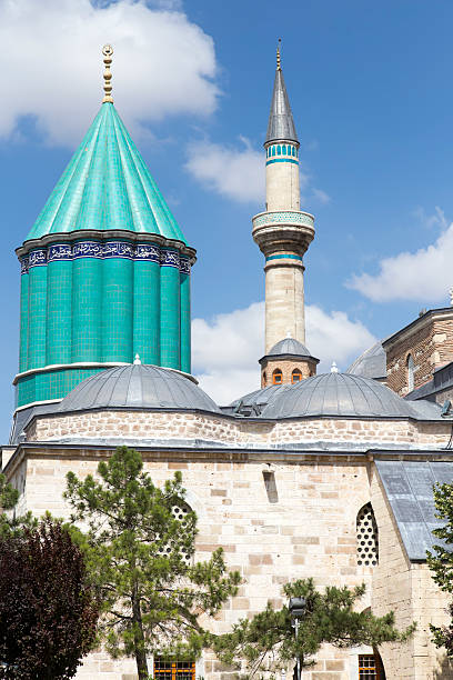 Tomb of Mevlana, the founder of Mevlevi sufi dervish order, with prominent green tower in Konya, TurkeyTomb of Mevlana, the founder of Mevlevi sufi dervish order, with prominent green tower in Konya, Turkey