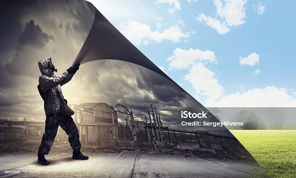 Stalker changing reality Image of man in gas mask turning page. Ecology concept Adult Stock Photo
