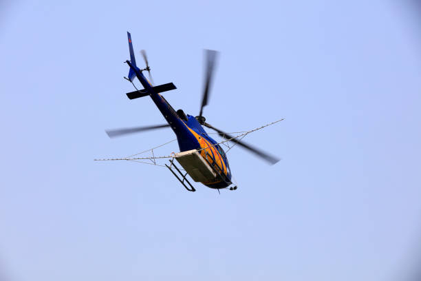 istock Agricultural helicopters fly in the air 1801198393