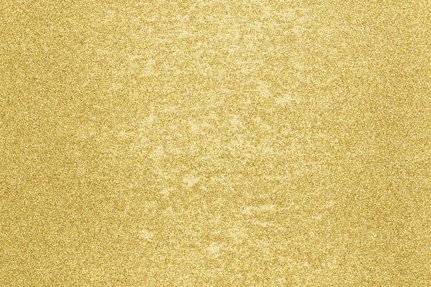 istock gold color glitter paper abstract, grunge texture background 1801202580