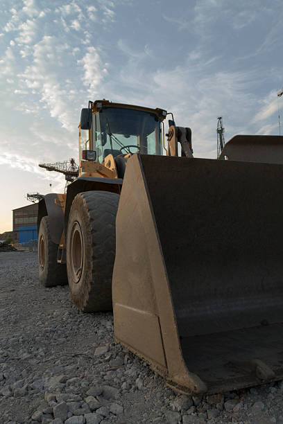 istock Large bulldozer with the shipyard on background 180120375