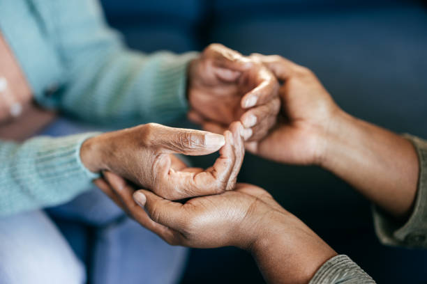istock Young woman holding elderly hands 1801206393