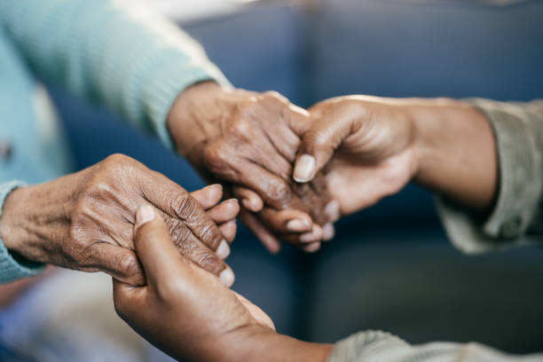 istock Young woman holding elderly hands 1801206394