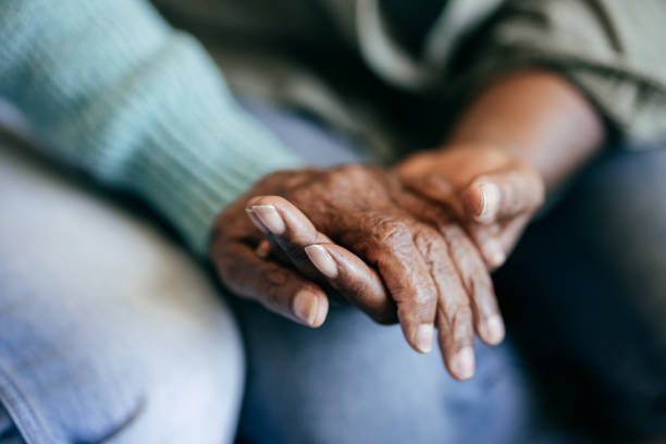 istock Young woman holding elderly hands 1801206395