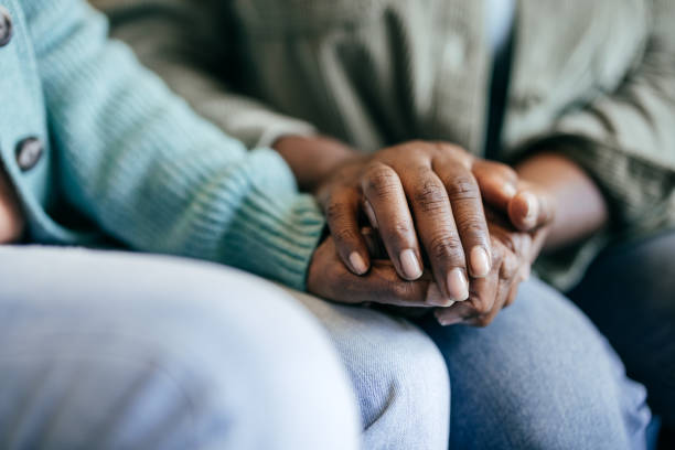 istock Young woman holding elderly hands 1801206400