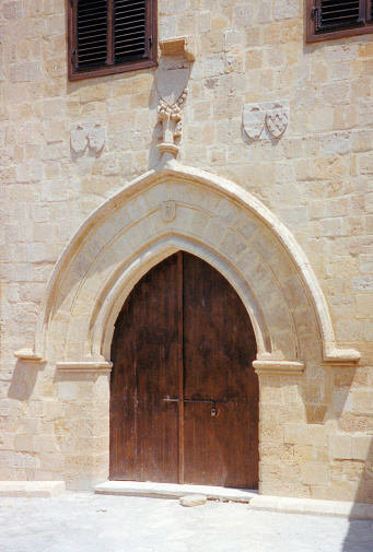 North Nicosia, North Cyprus (TRNC): Gothic gate with Lusignan coats of arms carved on top - Lusignan House (Lüzinyan Evi), 15th century - built as a residence for Latin nobles during the Lusignan period - Yeni Cami Street, Yeni Jami quarter.