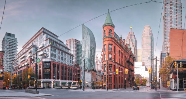 Toronto Skyline - The Gooderham Building The Gooderham building (also known at the Flatiron building) in downtown Toronto where Front Street meets Wellington in downtown Toronto.   It was constructed in 1892. flatiron building toronto stock pictures, royalty-free photos & images