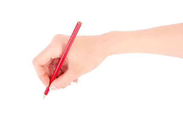 istock Woman's hand holding a red pencil 180125742