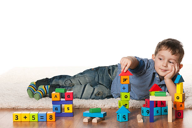 istock Playing on the carpet little boy 180126025