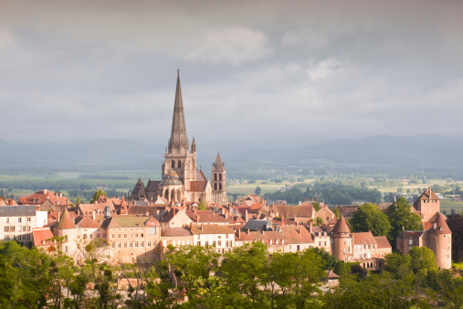 River in the town of Mayenne with Notre-Dame basilica and the castle, commune in the Mayenne department in north-western France