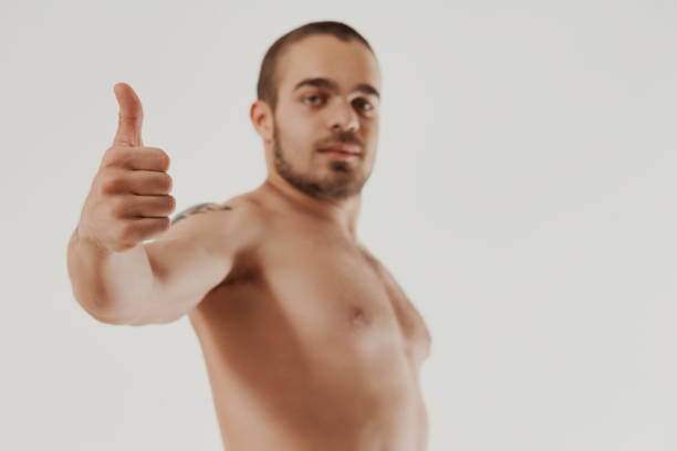 istock Shirtless endorsement with a thumbs-up 1801286511