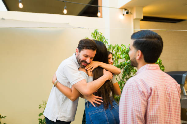 istock Excited happy women and men hugging before dinner in the backyard 1801309207