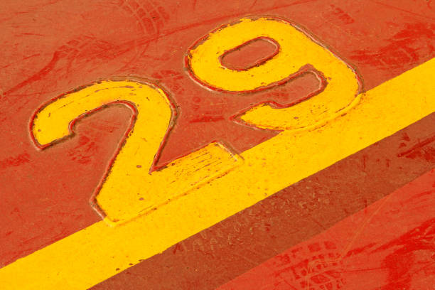 istock Numbers and lines in yellow brown sheet metal 1801362015