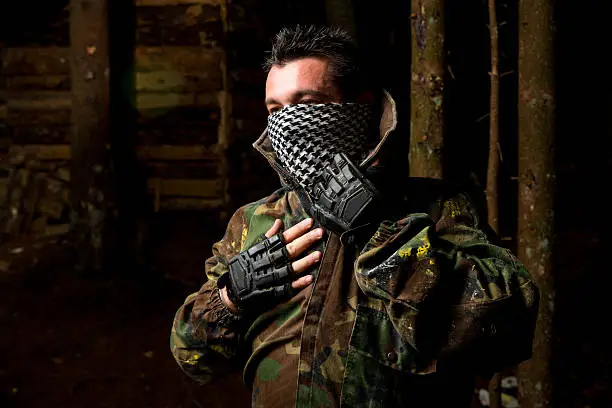 Photo of Paintball player preparing for battle